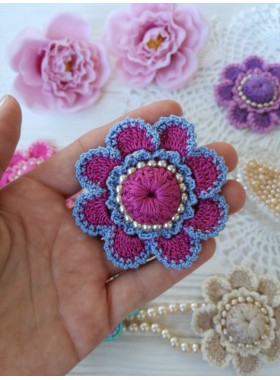 Crochet flower with pearls.
